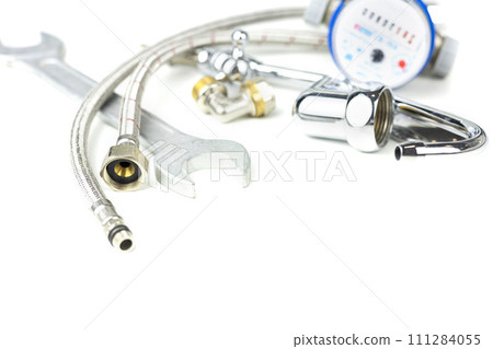 Plumbing parts, accessories and tools on a white background with copy space. 111284055