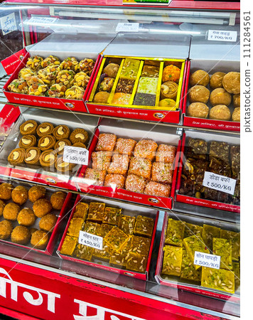 Traditional sweets in Prem Mandir Hindu temple in Vrindavan. High quality photo Traditional sweets in Prem Mandir Hindu temple in Vrindavan. High quality photo 111284561
