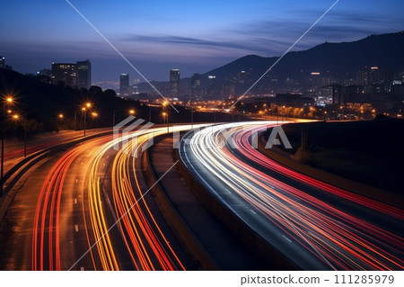 highway outside the city in the evening with blurry tracks from headlights highway outside the city in the evening with blurry tracks from headlights 111285979