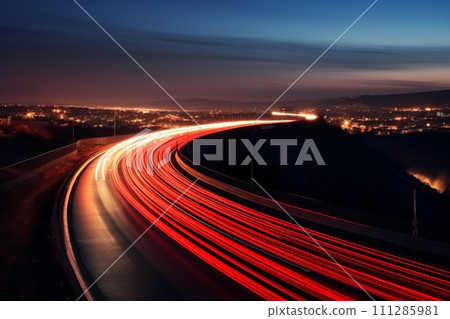 highway outside the city in the evening with blurry tracks from headlights 111285981