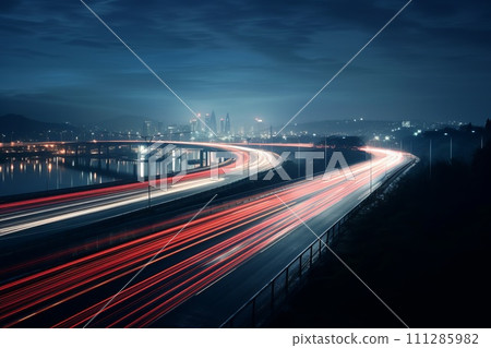 highway outside the city in the evening with blurry tracks from headlights 111285982