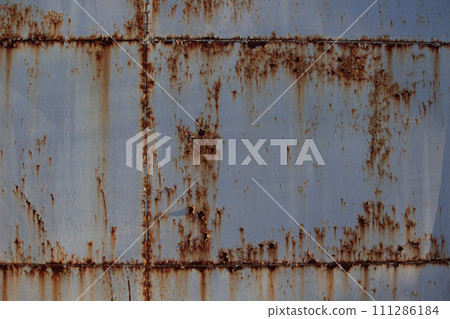 Rusty metal background with streaks of rust. 111286184