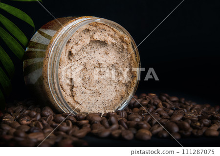 Coffee body scrub and coffee beans on dark background banner. Skincare, health care concept. 111287075