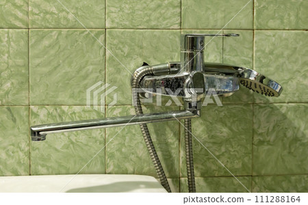 Dirty tap, in an old bathroom, limescale on the faucet. Concepts of dirty drinking water and water consumption. 111288164