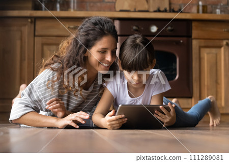 Mexican nanny watch education channel with small girl on pad 111289081