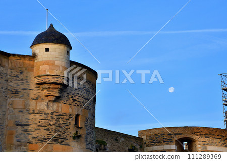 Angers, France. Angers castle and the moon in the morning. Photographed on December 29, 2023. Angers, France. Angers castle and the moon in the morning. Photographed on December 29, 2023. 111289369