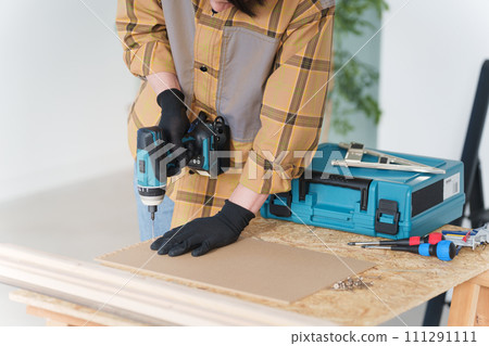 Middle-aged man doing DIY at home Middle-aged man doing DIY at home 111291111