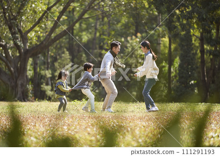 asian family enjoying outdoor activity in city park asian family enjoying outdoor activity in city park 111291193