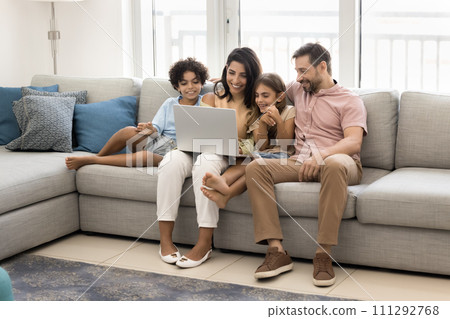 Cheerful sweet preteen kids and couple of parents enjoying leisure 111292768