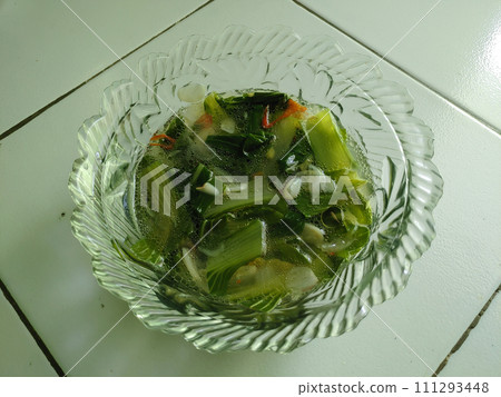 Vegetable Soup in clear bowl. Traditional hot veggie soup and delicious. 111293448