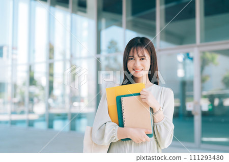 Female college student walking on campus 111293480