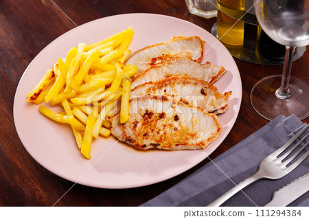 Fried barbecue pork meat with baked potato 111294384