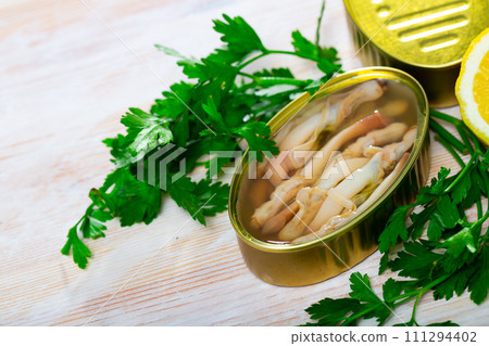 Canned ensis with lemon and greens Canned ensis with lemon and greens 111294402