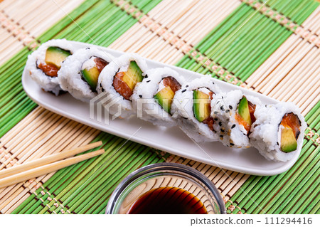 Uramaki roll with salmon, avocado and cream cheese 111294416
