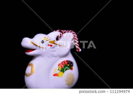 New Year's material Year of the Dragon Zodiac earthen bell Black background 111294974