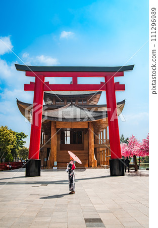 Asian girl in kimono and umbrella in Japanese theme park Hinoki Land in Chai Prakan District, Chiang Asian girl in kimono and umbrella in Japanese theme park Hinoki Land in Chai Prakan District, Chiang 111296989