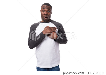 young charming happy african guy with short haircut dressed in long sleeve summer sweater 111298110