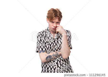 young tired man with reddish golden hair shows emotion of sadness 111298145