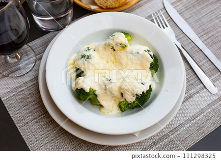 Broccoli and cauliflower gratin with cheese. Broccoli and cauliflower gratin with cheese. 111298325