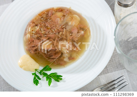 Traditional dish of Russian cuisine is a kholodets 111298369