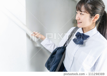 Smiling high school students, junior high school students, high school girls (uniforms, school uniforms) walking in school buildings, corridors, and stairs Smiling high school students, junior high school students, high school girls (uniforms, school uniforms) walking in school buildings, corridors, and stairs 111298389