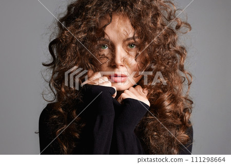 beautiful young woman with curly hair. beauty portrait of hair girl beautiful young woman with curly hair. beauty portrait of hair girl 111298664