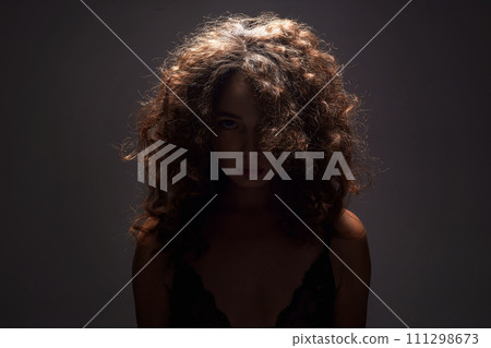 Beautiful Woman with curly Hair. Hairy Girl silhouette 111298673