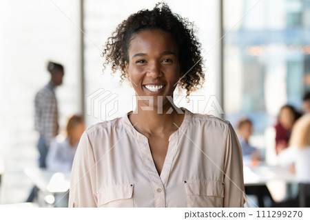 Happy smiling millennial mixed race woman student posing at university 111299270