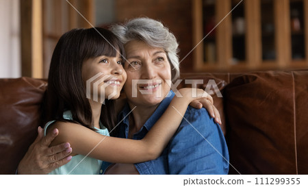 Senior hispanic nanny dream together with small school girl ward 111299355