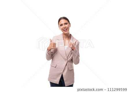 young stylish brunette woman dressed in a beige jacket and jeans on a white background young stylish brunette woman dressed in a beige jacket and jeans on a white background 111299599