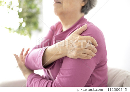 Senior woman shoulder pain osteochondrosis 111300245