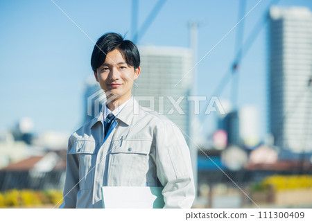 A man wearing work clothes 111300409