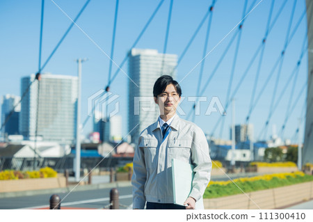 A man wearing work clothes 111300410