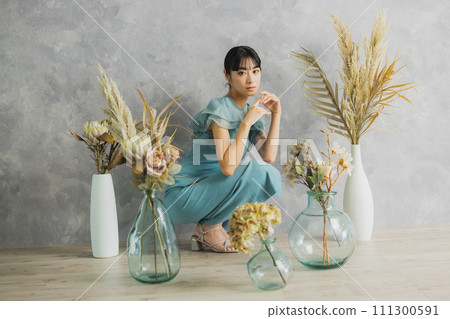 A woman with flowers 111300591