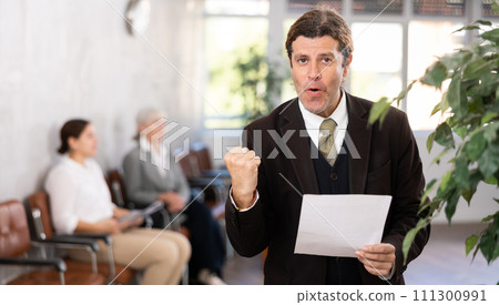 Successful businessman rejoices in signed contract 111300991