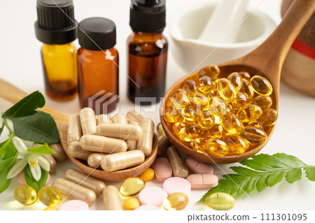 Alternative medicine herbal organic capsule with vitamin E omega 3 fish oil, mineral, drug with herbs leaf natural supplements for healthy good life. Alternative medicine herbal organic capsule with vitamin E omega 3 fish oil, mineral, drug with herbs leaf natural supplements for healthy good life. 111301095