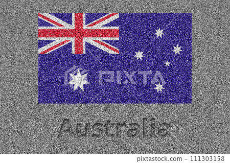 The Australian flag drawn on a stone slab and the carved words "Australia" 111303158