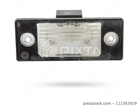 spare part from the car on a white isolated background is a cover for the illumination of a standard sign on the trunk lid for replacement and repair. Spare parts catalog. spare part from the car on a white isolated background is a cover for the illumination of a standard sign on the trunk lid for replacement and repair. Spare parts catalog. 111303929
