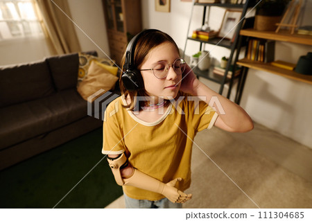 Enjoying relaxation music in headphones 111304685