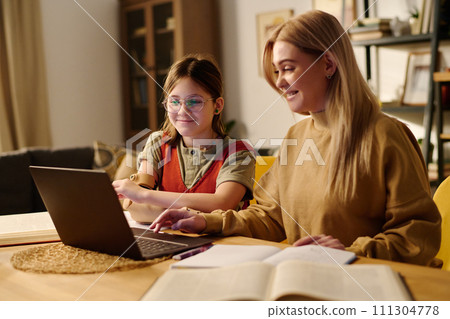 Girl having home lesson with tutor 111304778
