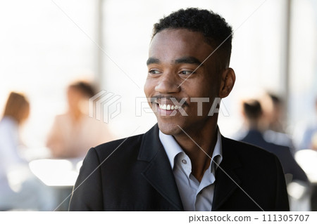 Smiling motivated young black man manager feel satisfied with job Smiling motivated young black man manager feel satisfied with job 111305707