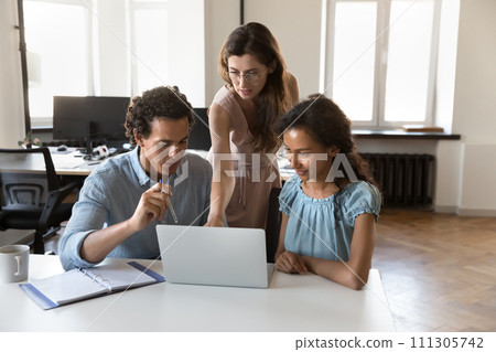 Busy motivated multiethnic employees using computer at office table 111305742