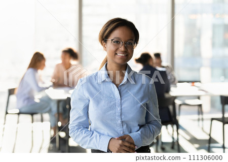 Friendly young lady receptionist meeting you client at bank office Friendly young lady receptionist meeting you client at bank office 111306000