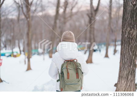 Woman tourist with snow in winter season at Zao fox village, traveler sightseeing Miyagi prefecture. landmark and popular for attraction near Sendai, Tohoku, Japan. Travel and Vacation 111306068
