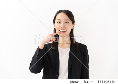 Young woman dental care pointing Young woman dental care pointing 111306310