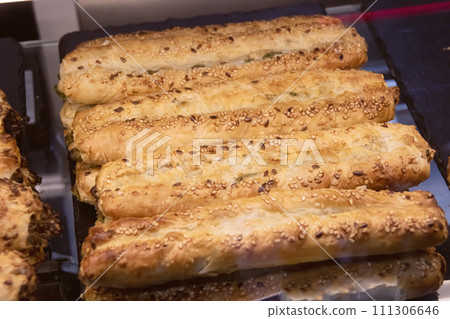 Ruddy long buns on table close up 111306646