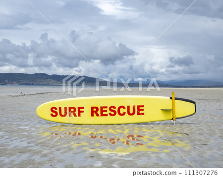 Yellow coast guard rescue surfboard at Narin Beach by Portnoo, County Donegal - Ireland 111307276