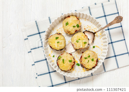 mini eggplant pizzas with tomato sauce and cheese 111307421