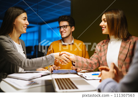 Group of young businesspeople working together in creative office. Planning, analysis, collaborate. 111307563