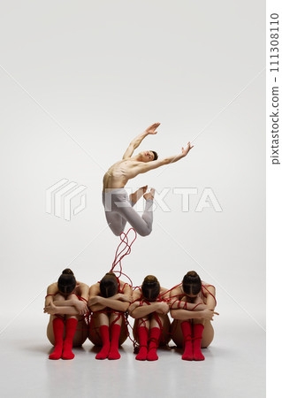 against white studio background 111308110